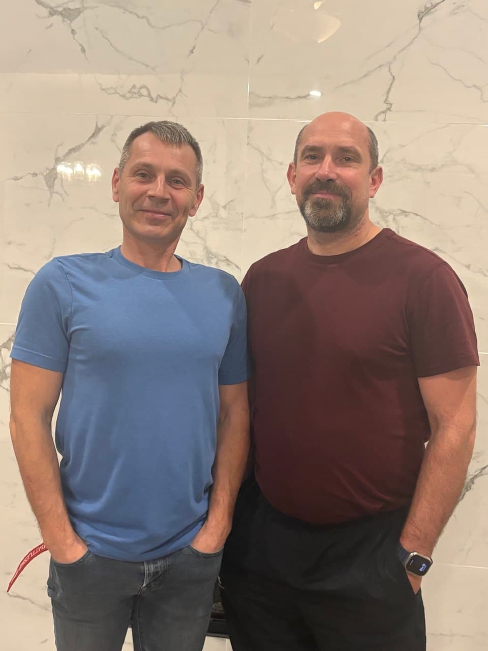 The Perfect House VL team — Vitaliy and partner — in front of marble tile work